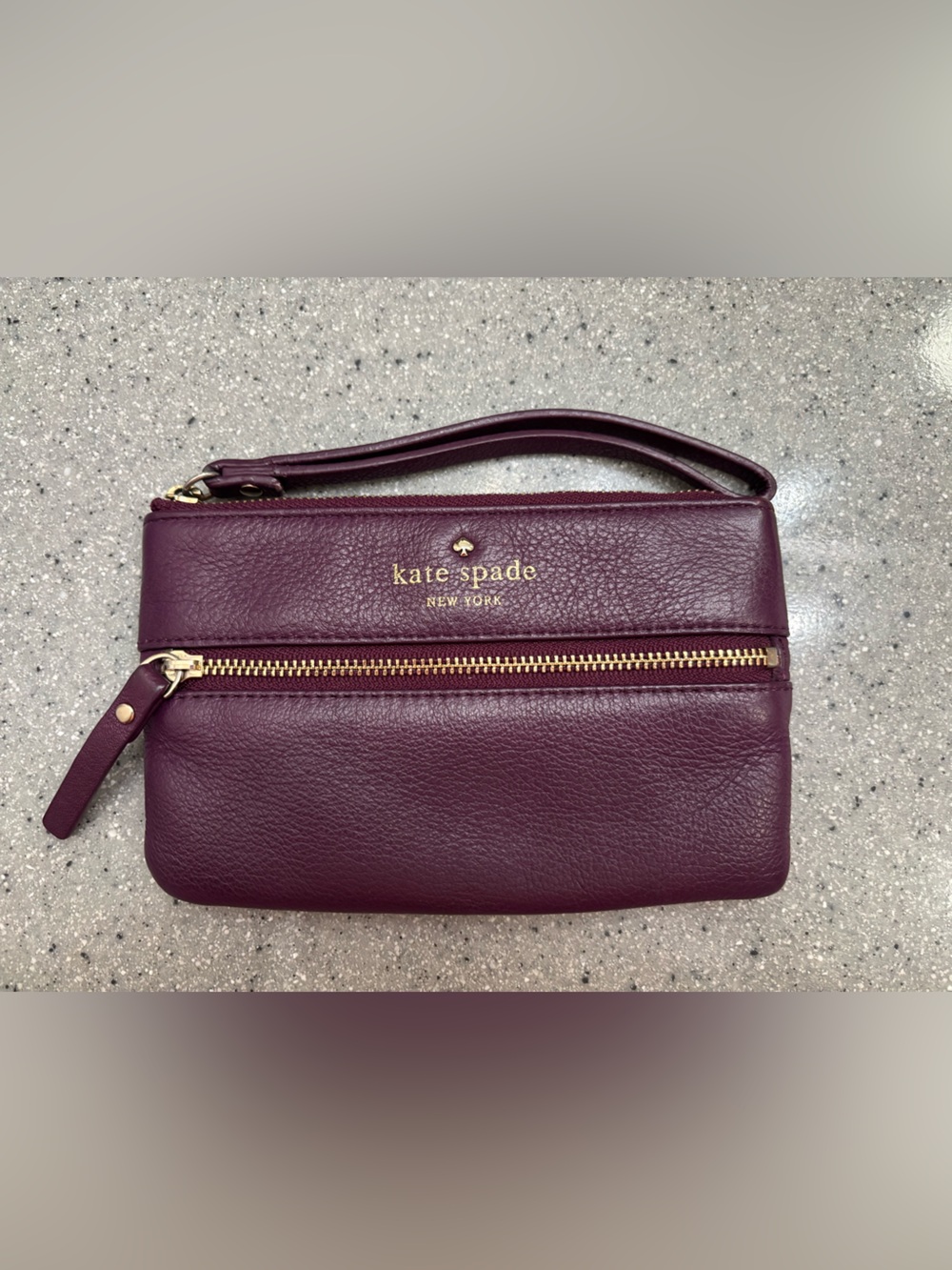 kate spade plum pebbled leather wristlet with gold hardware